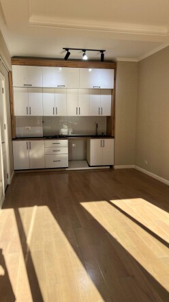 Near İnşaatçılar metro station, 2-room new building, 55 m² – For sale